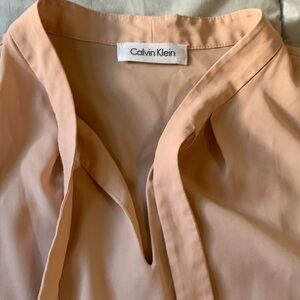 Clavi Klein blouse measures as a medium tag doesn’t specify